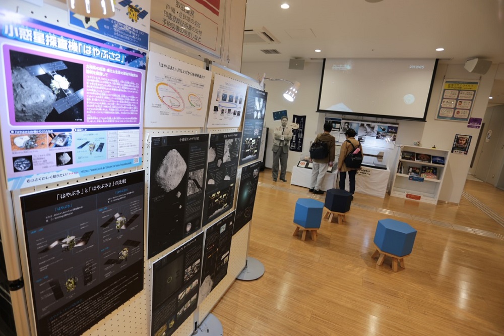 A replica sample from the Ryugu asteroid is displayed at Kokubunji Peace Plaza. (ANJ)