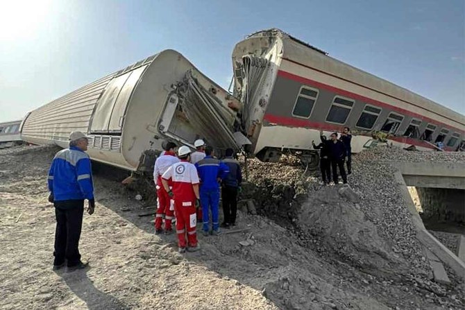 Above, the train derailed after hitting an excavator near the central Iranian city of Tabas, on the line between the cities of Mashhad and Yazd. (Iranian Red Crescent via AFP)