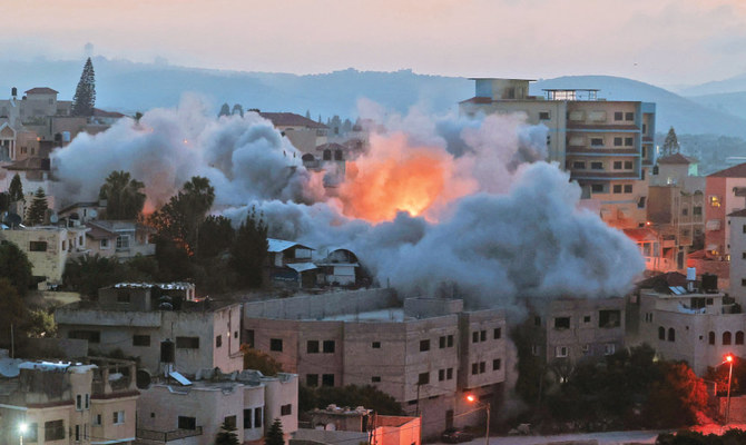 The Israeli Army blows up the family house of Diaa Hamarsha, a slain Palestinian, in the village of Yabad, near the occupied West Bank town of Jenin, on Thursday. (AFP)