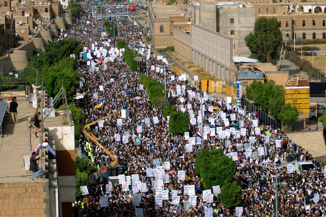 Houthis rally in Sanaa on June 3, 2022, a day after the Iran-backed militia agreed to renew a two-month truce with the UN-recognized government. (AFP)