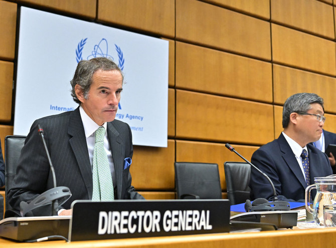 IAEA Director-General Rafael Grossi, left, and China's Ambassador to the UN, Wang Qun, attending the UN agency's meeting on June 06, 2022. (JOE KLAMAR / AFP)