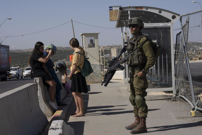 The settlers could lose their ability to use national health insurance for treatment inside the West Bank, and the ability to update their status in the population registry and get national ID cards — something routinely denied to Palestinians. (File/AP)
