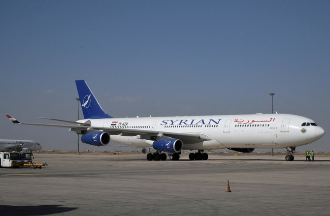 A SyrianAir Airbus A340-300 is pictured at Damascus International Airport, in this handout released by SANA on October 1, 2020, Syria. (SANA/Handout via Reuters)