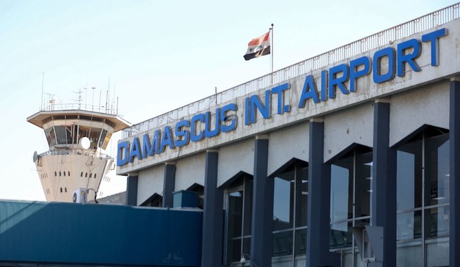 This file photo taken on October 1, 2020 shows the Syrian flag flying at Damascus International Airport outside Syria's capital. (AFP)