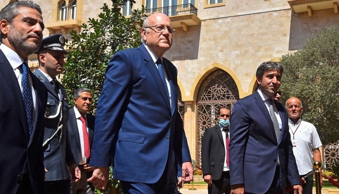 Najib Mikati arrives at the Grand Serail in Beirut. (AFP)