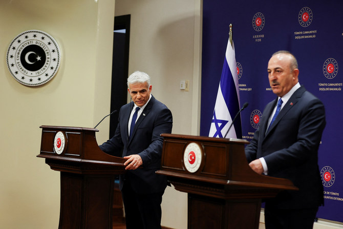 Israel's Foreign Minister Yair Lapid and Turkey's Foreign Minister Mevlut Cavusoglu attend a news conference as they meet in Ankara, Turkey June 23, 2022. (Reuters)