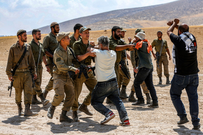 Israeli soldiers clash with protesters during a demonstration against eviction of Palestinian villages in occupied West Bank. (AFP)