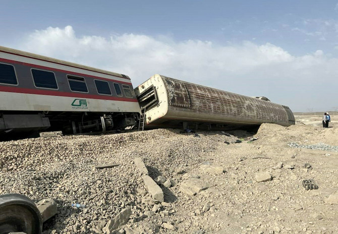 Above, the train derailed after hitting an excavator near the central Iranian city of Tabas, on the line between the cities of Mashhad and Yazd. (Iranian Red Crescent via AFP)