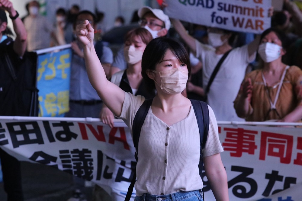 Nearly 200 students and trade unionists marched on Tuesday in the Shinjuku district of Tokyo to protest against the G7 summit and Japan's participation in a meeting of NATO. (ANJ/ Pierre Boutier)