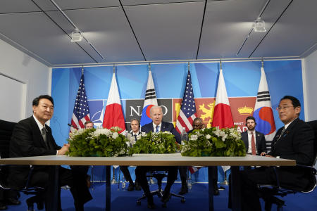 President Joe Biden (centre) meets with Japan's Prime Minister Fumio Kishida (right) and South Korea's President Yoon Suk Yeol (left) during the NATO summit in Madrid, Wednesday, June 29, 2022. (AP)