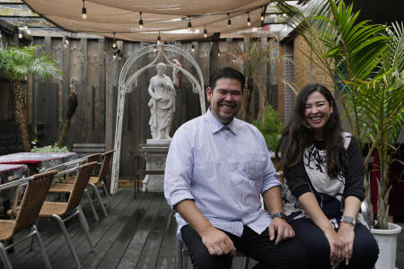 Norberto Semanaka and his sister Silvia, who both were born in Brazil and now live in Japan, pose for a photo at a Brazilian restaurant he runs in Oizumi town, about 90 kilometers (55 miles) northwest of Tokyo, Tuesday, May 31, 2022. (AP)