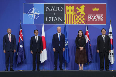 Australia's Prime Minister Anthony Albanese, Japan's Prime Minister Fumio Kishida, NATO Secretary General Jens Stoltenberg, New Zealand's Prime Minister Jacinda Ardern and South Korea's President Yoon Suk Yeol, from left, pose for media in a group photo of Indo-Pacific partners nations during the NATO summit in Madrid, Spain, on Wednesday, June 29, 2022. (AP)