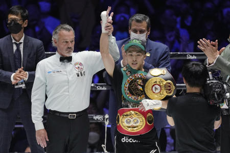 Japan's Naoya Inoue celebrates after defeating Philippines' Nonito Donaire in the bantamweight title unification boxing match of WBA, WBC and IBF in Saitama, north of Tokyo, Tuesday, June 7, 2022. (AP)