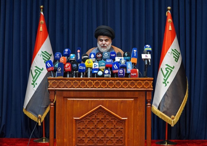 Moqtada Al-Sadr, Iraqi militia leader and Shiite cleric, made a high-stakes protest by calling on the 73 lawmakers loyal to him to ready resignation papers to end an eight-month parliamentary paralysis (File/AFP)