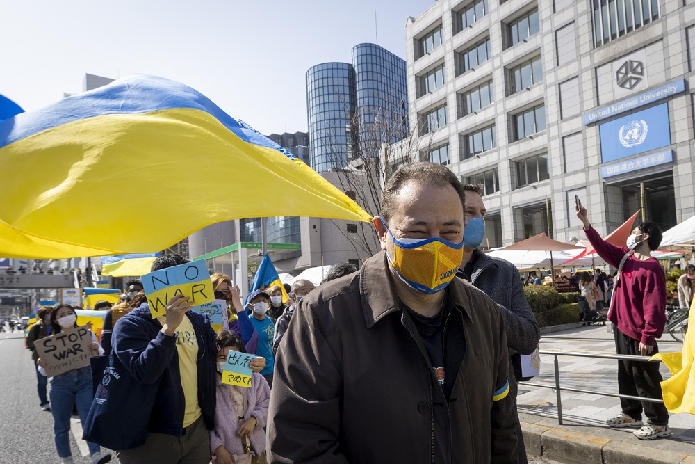 Ukraine’s Ambassador to Japan Sergiy Korsunsky marches past the United Nations University as he takes part in a protest against Russia's actions in Ukraine, during a rally in Tokyo on March 5, 2022. (AFP/file)