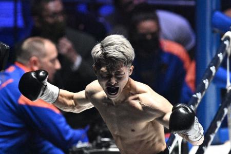 Japan's Naoya Inoue reacts after winning against Philippines' Nonito Donaire during their bantamweight unification boxing match at Saitama Super Arena in Saitama on June 7, 2022. (AFP)