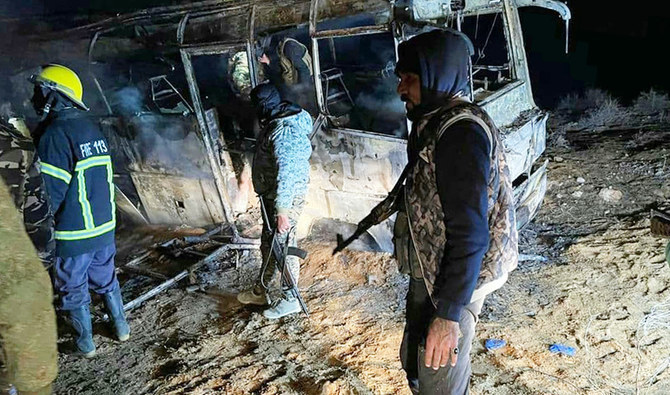 An attack scene targeting a bus transporting regime soldiers in January 2021 in Syria’s eastern province of Deir el-Zour, where on Thursday militants attacked a civilian bus, killing three people and wounding 21. (AFP)