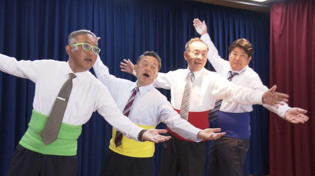 The group from the town of Wake, Okayama Prefecture, was formed with a wish to bring a smile to people's faces with videos of middle-aged, suit-clad men dancing. (Twitter screenshot)