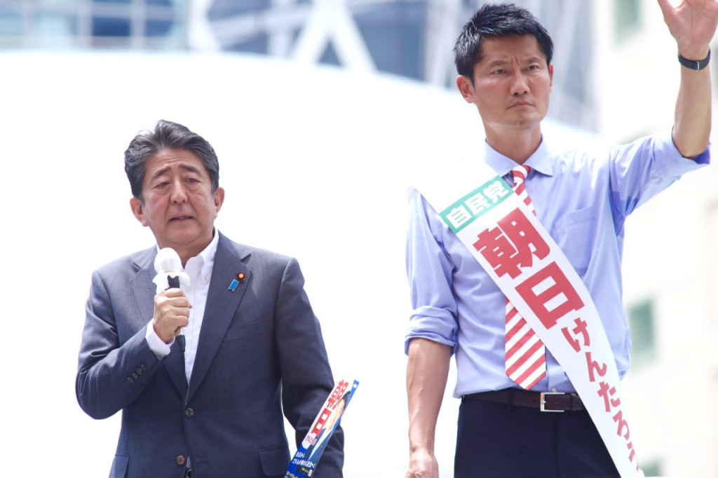 Former prime minister Shinzo Abe (L) gives a speech in support of former Olympic volleyball player Kentaro Asahi, a candidate for the House of Councilors. (ANJ/ Pierre Boutier)