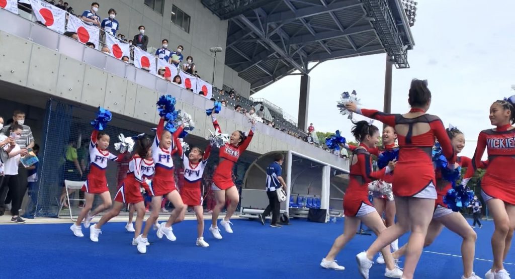 Cheerleaders and hockey players from Japan’s national team and selected teams attend the ceremony at the reopening of the Olympic Hockey Stadium in Tokyo. (ANJ/ Pierre Boutier)