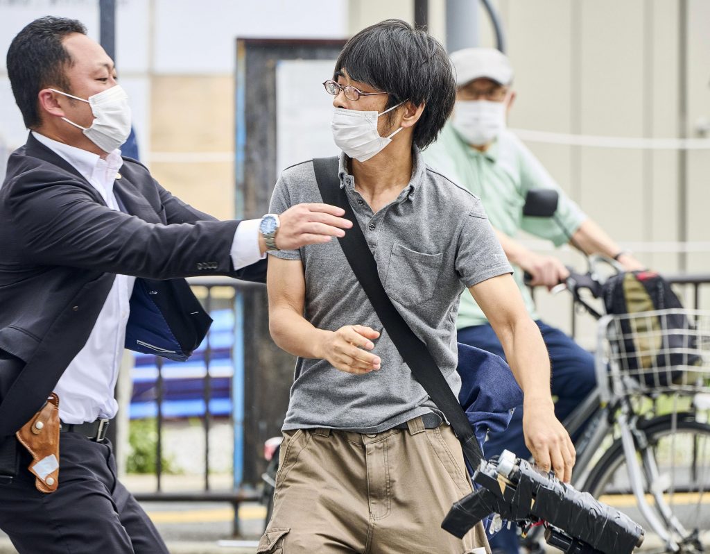 The Abe murder suspect, Tetsuya Yamagami, 41, has told investigators that his family was financially ruined due to his mother's large donations to the religious group, which he believed Abe had links to. (Kyodo News via AP)