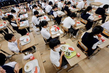Students take a school lunch at Senju Aoba Junior High School in Tokyo, Japan June 29, 2022. (Reuters)
