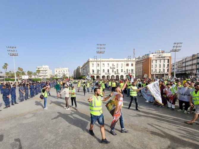 Libyans gather at the Martyrs’ Square of Libya’s capital Tripoli on July 1, 2022, to protest against the political situation and dire living conditions. (AFP)