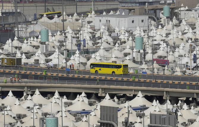 A buss carrying Muslim pilgrims passes over the Mina tent camp during the Hajj, in Makkah, Saudi Arabia, Thursday, July 7, 2022. (AP)