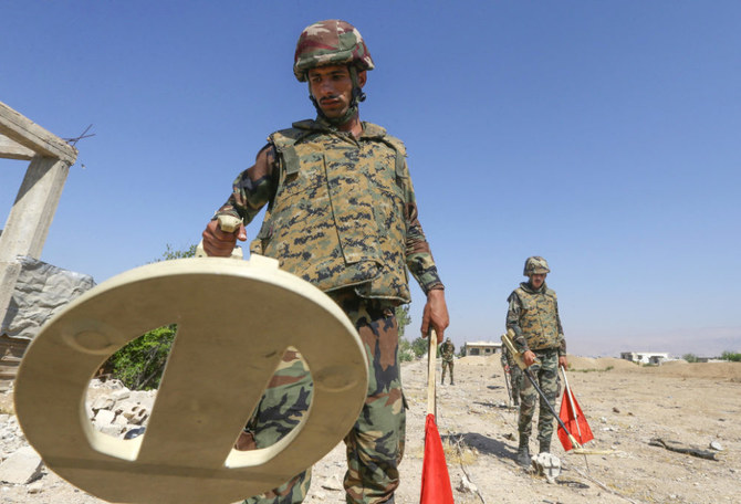 Syrian soldiers take part in a training session to remove and neutralise unexploded weapons, in the countryside of the capital Damascus, on June 19, 2022. (AFP)