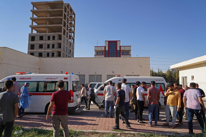 People gather outside a hospital following Turkish shelling in the city of Zakho in the north of Iraq's autonomous Kurdish region on July 20, 2022. (AFP)