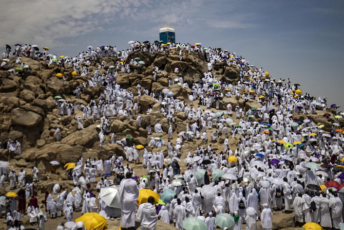 Pilgrims gather atop Mount Arafat, also known as Jabal al-Rahma (Mount of Mercy) in Makkah during the climax of the Hajj pilgrimage on July 8, 2022. (Delil Souleiman / AFP)