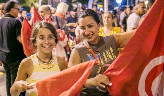 Supporters of President Kais Saied celebrate referendum results. (AP)