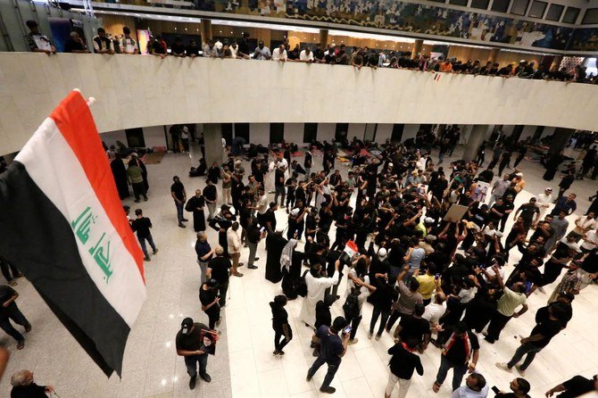 Supporters of Iraqi cleric Moqtada Sadr gather inside Iraq's parliament in the capital Baghdad's high-security Green Zone, on July 31, 2022, a day after storming it. (AFP)