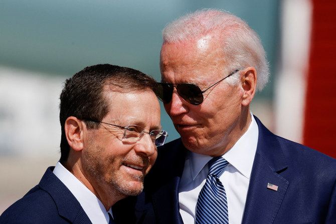 Israeli President Isaac Herzog and US President Joe Biden participate in a ceremony at Ben Gurion International Airport in Israel, July 13, 2022. (Reuters)
