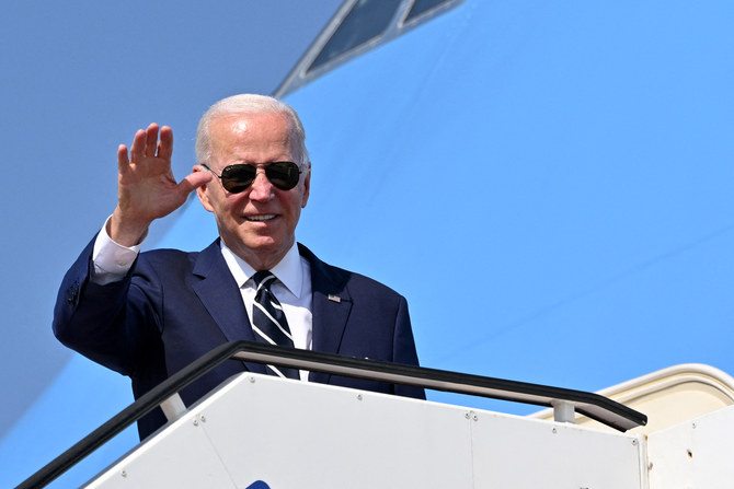 US President Joe Biden waves before boarding Air Force One to depart Israel's Ben Gurion Airport. (MANDEL NGAN/AFP)