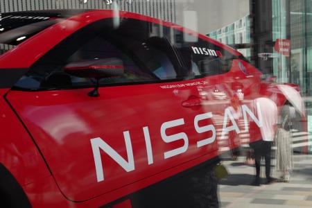 The logo of Japan's Nissan Motor is displayed on a vehicle at the company's car showroom in Tokyo on July 28, 2022. (AFP)