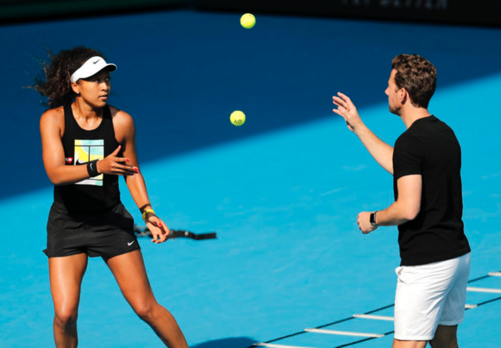 Japan’s Naomi Osaka warms up with her coach Wim Fissette during a practice session in Melbourne. Fissette wrote on Instagram on Wednesday that they are ending their partnership. (File/AP)