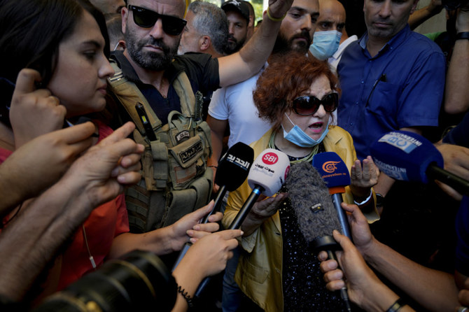 Lebanese Judge Ghada Aoun speaks to the press after raiding the Central Bank with security forces to pursue Central Bank Governor Riad Salameh, who she has charged with corruption in Beirut, Lebanon, Tuesday, July 19, 2022. (AP)