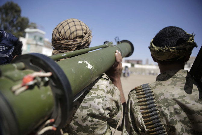 A Houthi rebel fighter holds a weapon during a gathering aimed at mobilizing more fighters for the Houthi movement, in Sanaa, Yemen, Thursday, Feb. 20, 2020. (AP)