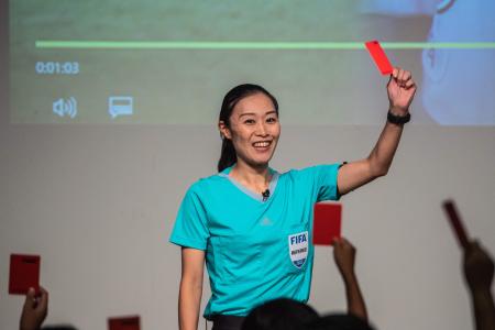 Japan's first female professional referee Yoshimi Yamashita attends a public event before a press conference in Japan football museum in Tokyo on August 1, 2022. (AFP)