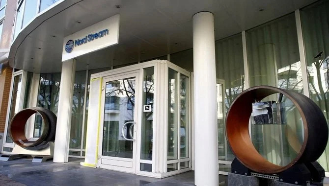 The logo of Nord Stream and segments of pipeline tubes at the HQ of Nord Stream AG in Zug, Switzerland, Mar. 1, 2022. (Reuters)
