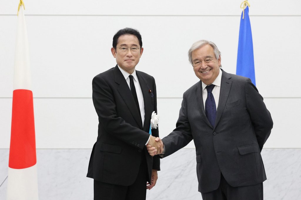 U.N. Secretary General Antonio Guterres, right, and Japanese Prime Minister Fumio Kishida shake hands before their meeting in Hiroshima, western Japan Saturday, Aug. 6, 2022. (File photo/Kyodo News via AP)