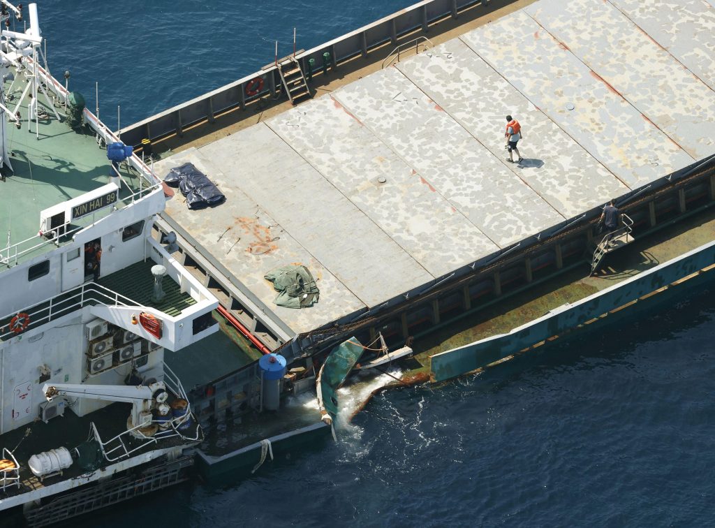 This aerial photo shows Belize-registered cargo ship Xin Hai 99, after a collision, off Kushimoto, Wakayama prefecture, southwestern Japan, Aug. 20, 2022. (File photo/Kyodo News via AP)