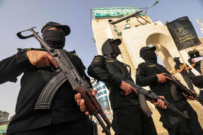 Islamic Jihad fighters take part in a demonstration marking Palestinian Prisoners' Day in Rafah, Gaza strip, on April 17, 2022. (Said Khatib / AFP)