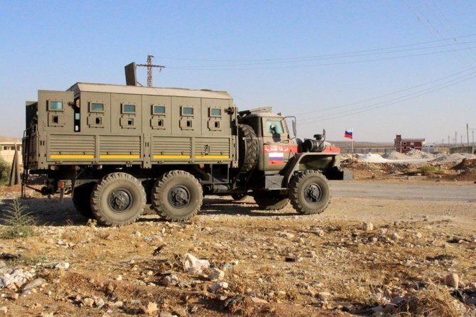 A military vehicle belonging to the Russian and Syrian coalition troops in Daraa. A Daesh group leader blew himself up Daraa after being surrounded by government forces on Wednesday. (AFP/File)