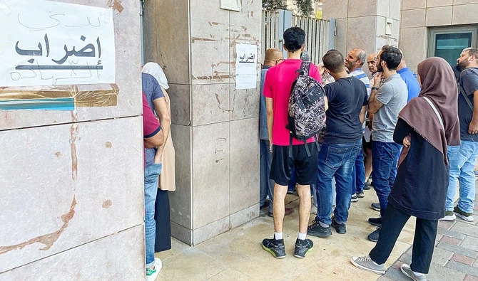 Thousands of state employees in Lebanon have been on strike for over two months over the collapse of their wages caused by Lebanon’s economic implosion. (Reuters)