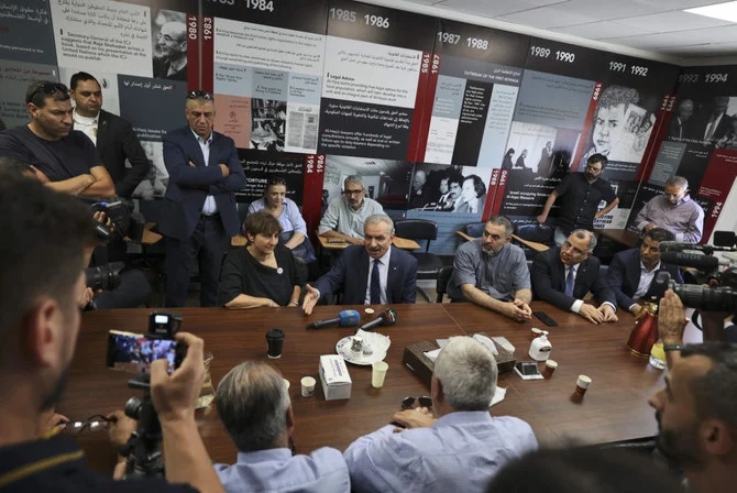 Palestinian Prime Minister Mohammad Shtayyeh speaks at the Palestinian Al-Haq Foundation in Ramallah on Aug. 18, 2022, after Israel raided and closed an entrance to their offices. (Abbas Momani / AFP)