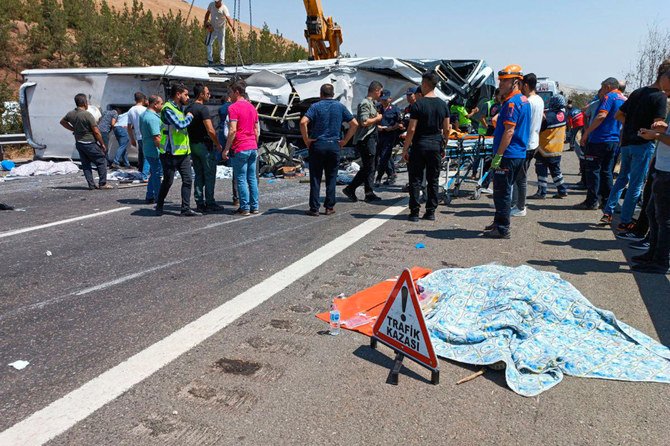 Rescue and emergency responders work at the scene after a bus crash on the highway between Gaziantep and Nizip in Turkey on August 20, 2022. (Ihlas News Agency via REUTERS)