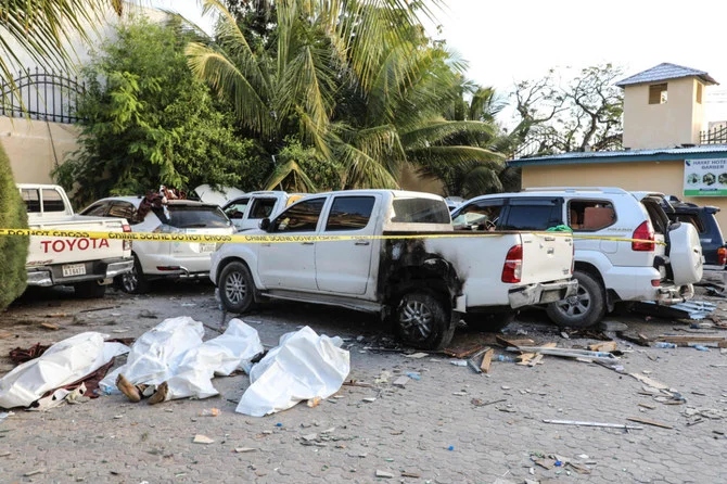 The bodies of the alleged attackers are seen on the ground inside the compound of the Hayat Hotel in Mogadishu on August 21, 2022. (Hassan Ali Elmi / AFP)