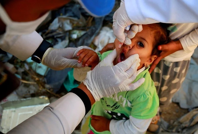 A girl receives a polio vaccine during a three-day immunization campaign in Sanaa, Yemen November 29, 2020. (Reuters)